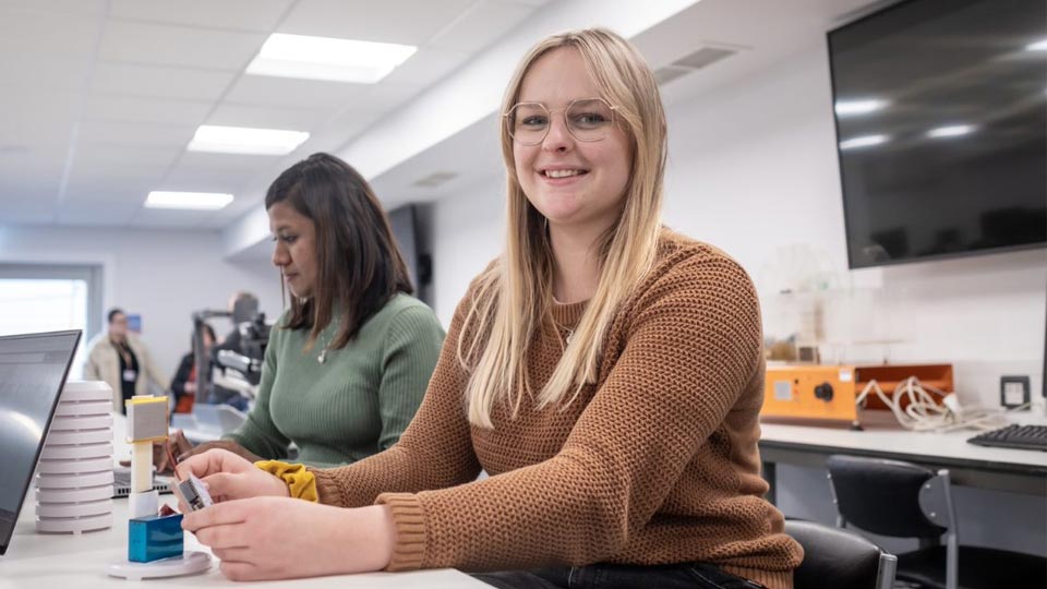 Jennifer sat at a desk