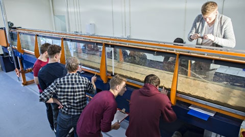 Students investigating the development of bedforms in sand-bed rivers