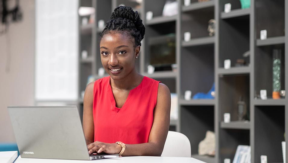 Michaela sat working on a laptop