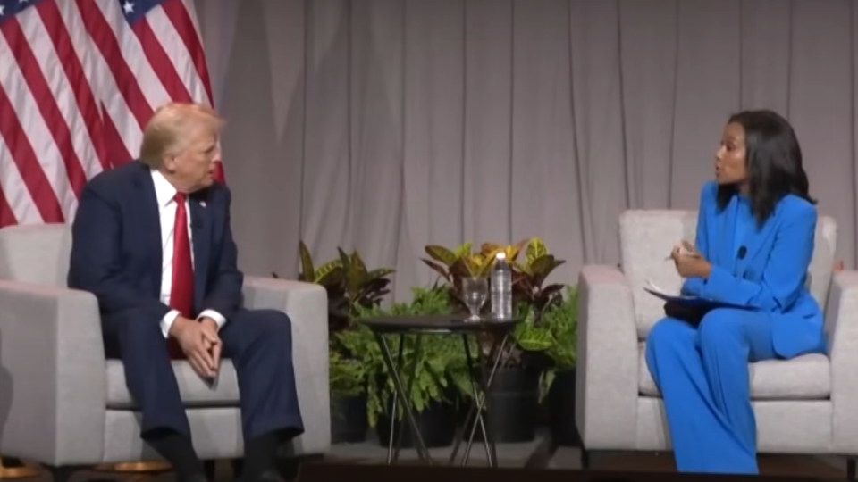 Donald Trump being interviewed on stage