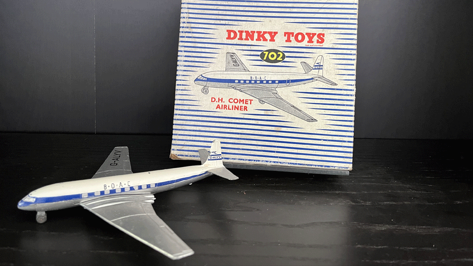 a mini toy plane and its box