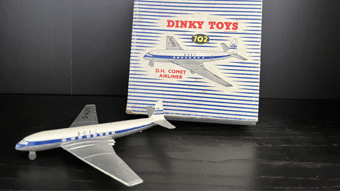 a mini toy plane and its box