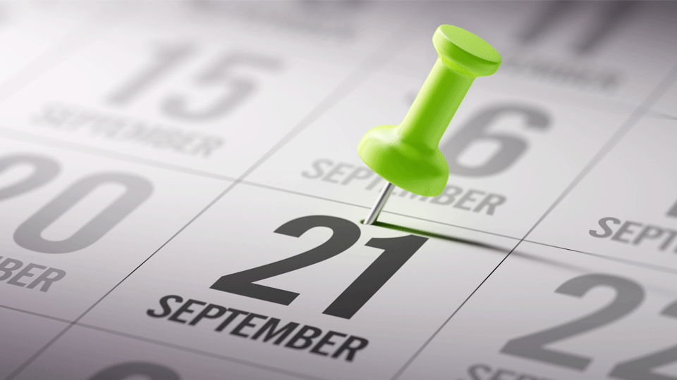 A calendar with a green pin in the date 21st September