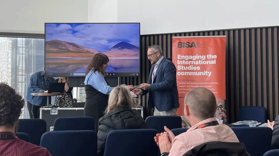 Caroline is presented with her award