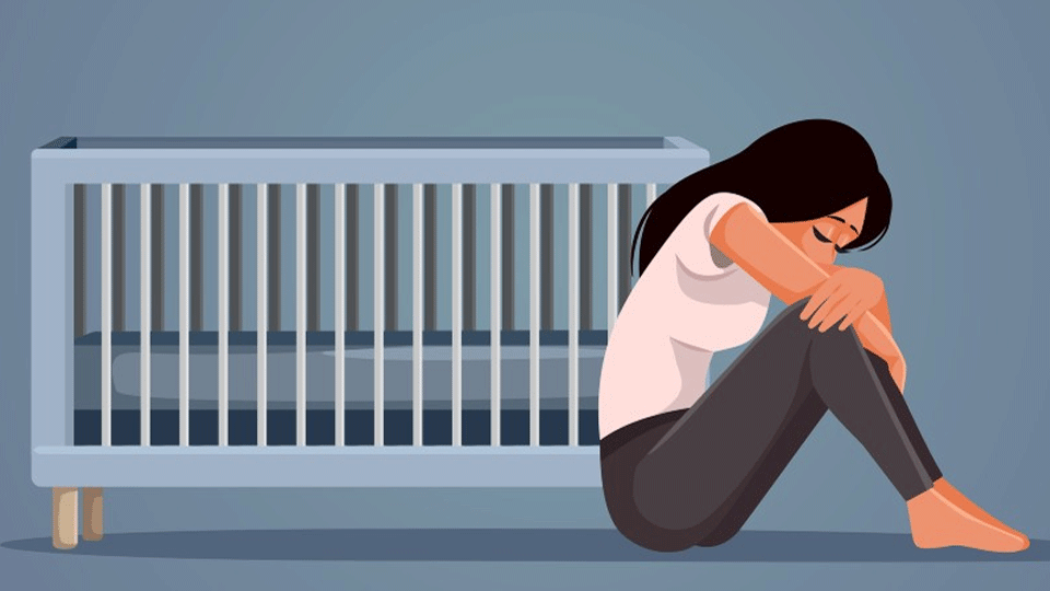 Graphic of a woman crying sat next to a crib