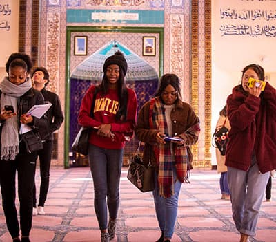 people in front of a mosque