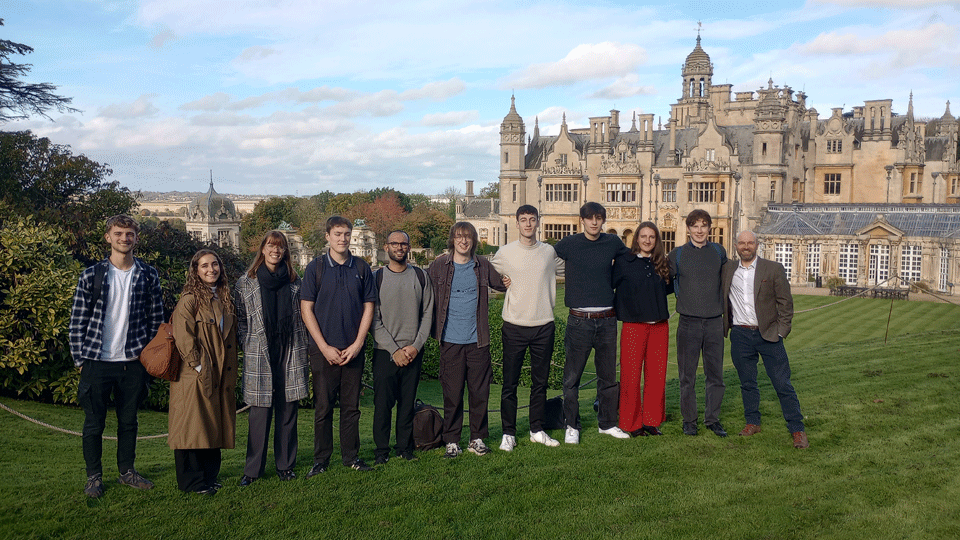 A group of students standing in front of Harlaxton Manor