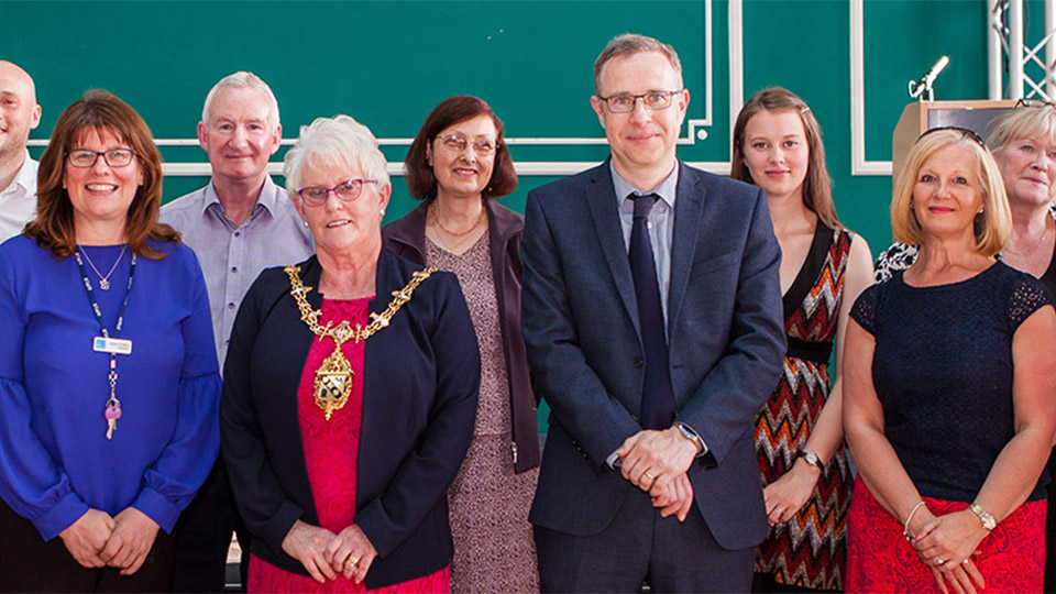 Members of the community receiving donations from the Chief Operating Officer