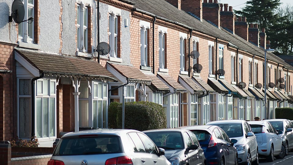 A Loughborough street with terrace housing and cars parked on the street