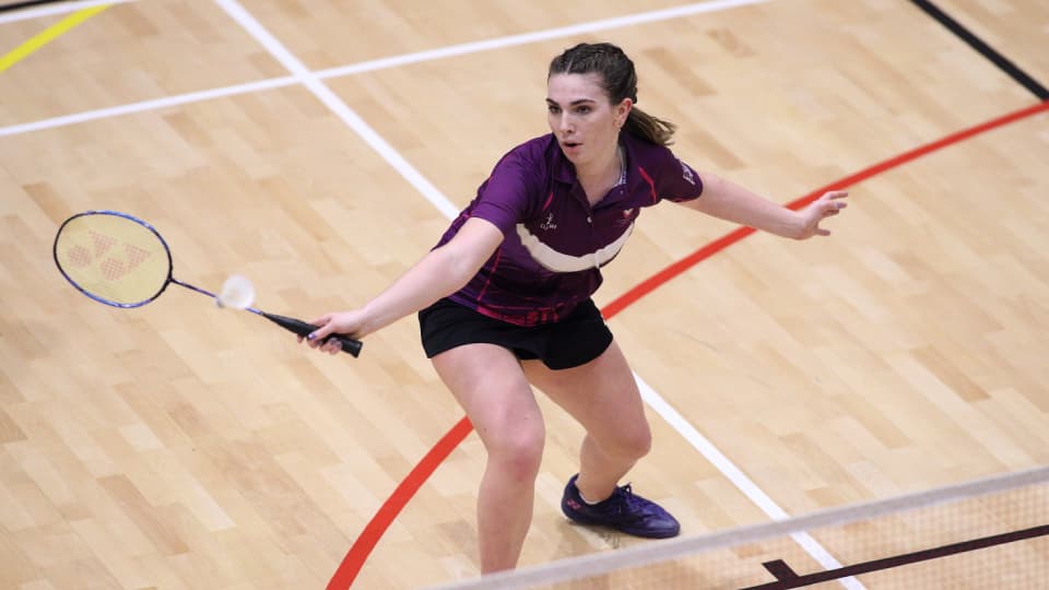 Lizzie Tolman playing badminton