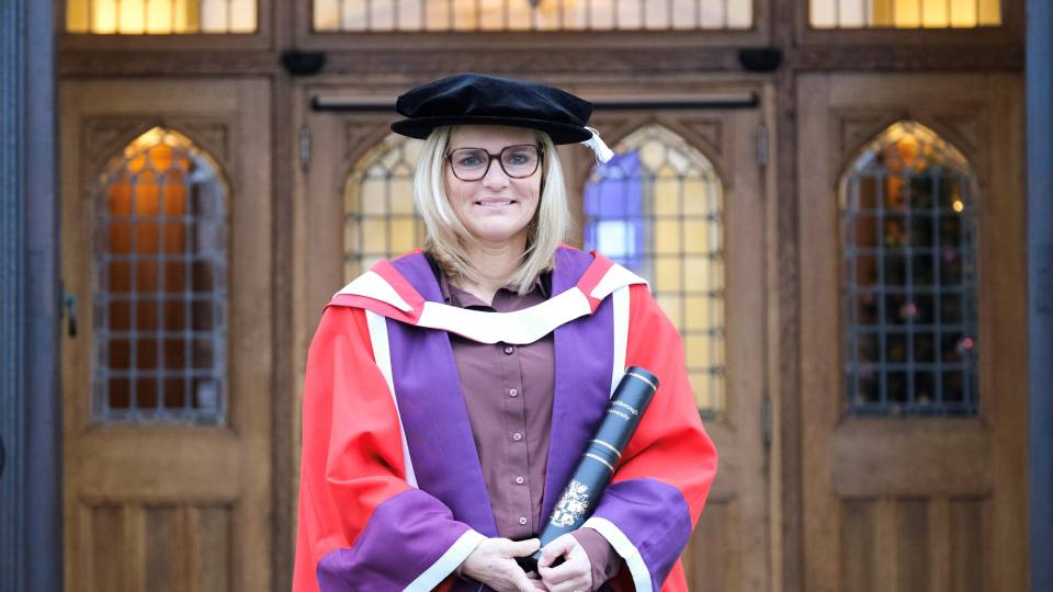 sarina weigman dressed in a honorary gown