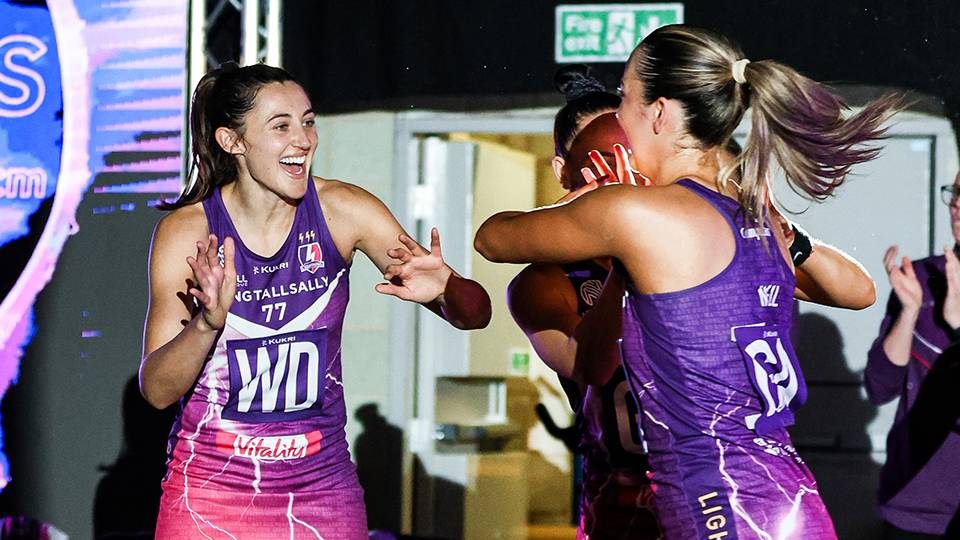 two netballers embrace