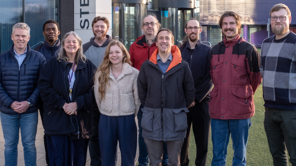 The Research Team standing outside the STEM Lab building