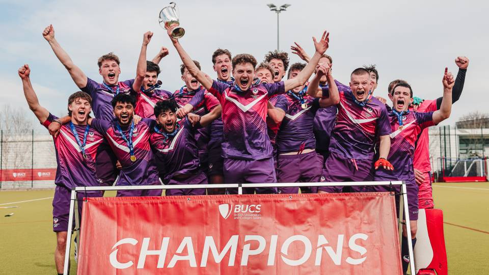 hockey players celebrate a title win