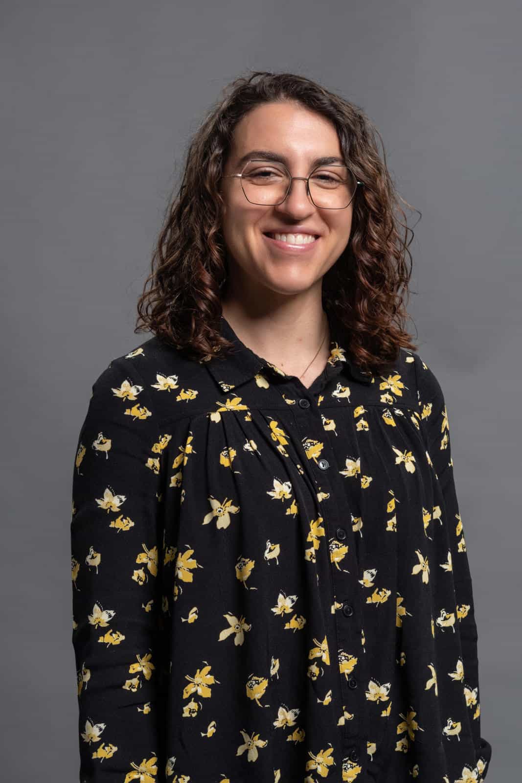 Close-up of Dr Amanda Pearce against a grey background.