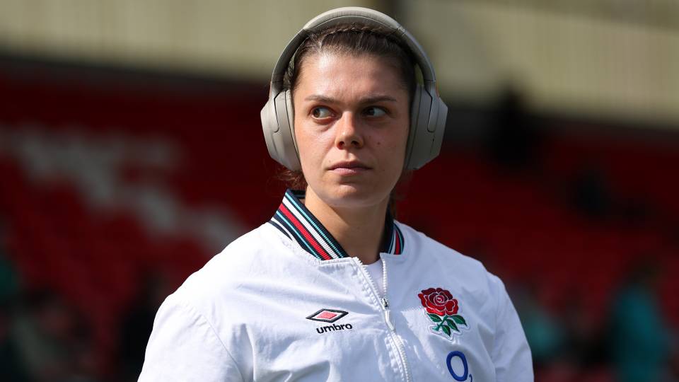 rugby player Helena Rowland wearing headphones pre match