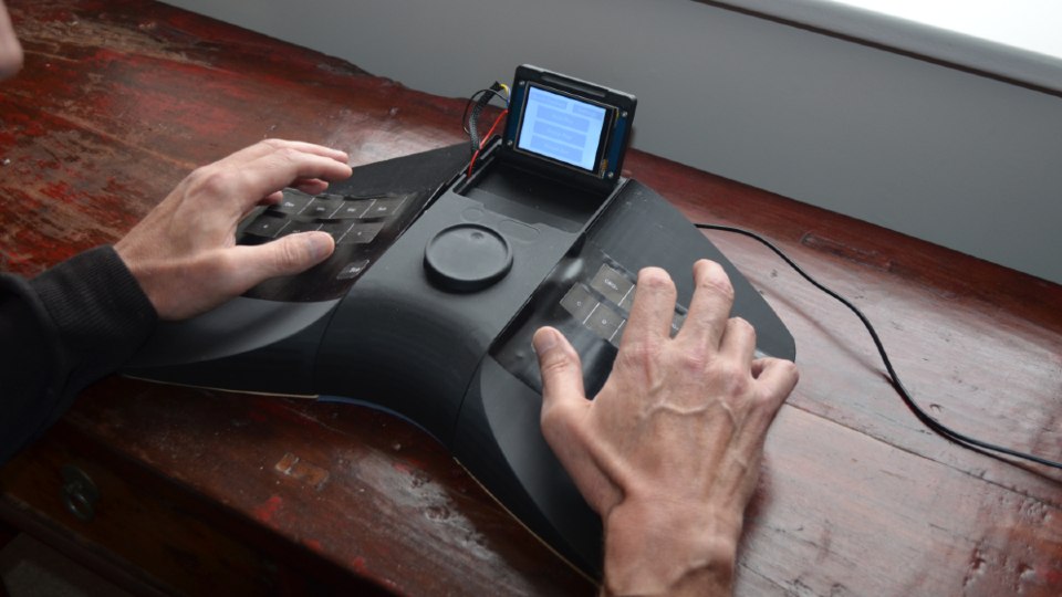 Close-up of a person using the Sonare prototype.