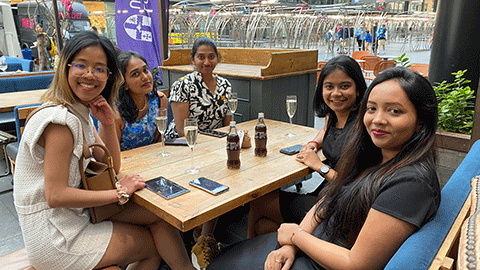 MBA students at table