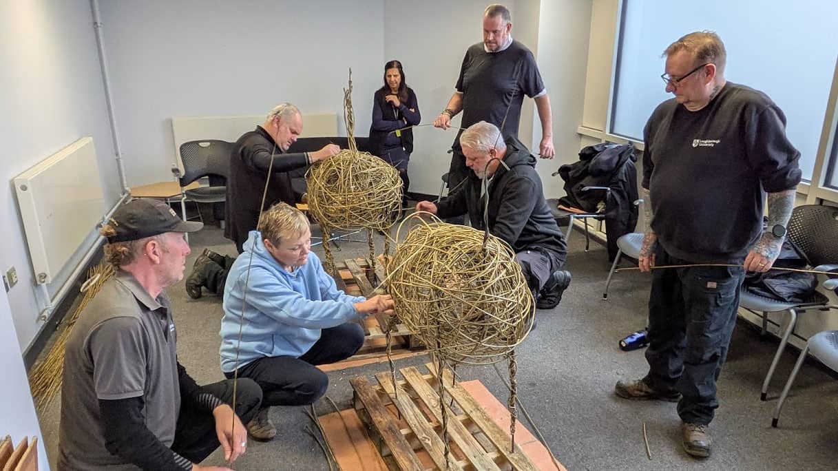 The University Gardens team crafting willow deer.