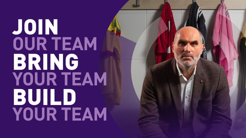 A man sitting down wearing a suit alongside text reading 'join our team, bring your team, build your team'.