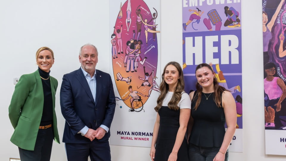 Pro-Vice Chancellor for Sport Professor Jo Maher, Vice-Chancellor and President Professor Nick Jennings, competition winner Maya Normal and LSU Sport EO Frankie Suckling stood next to Maya's mural design at the EmpowerHER closing event