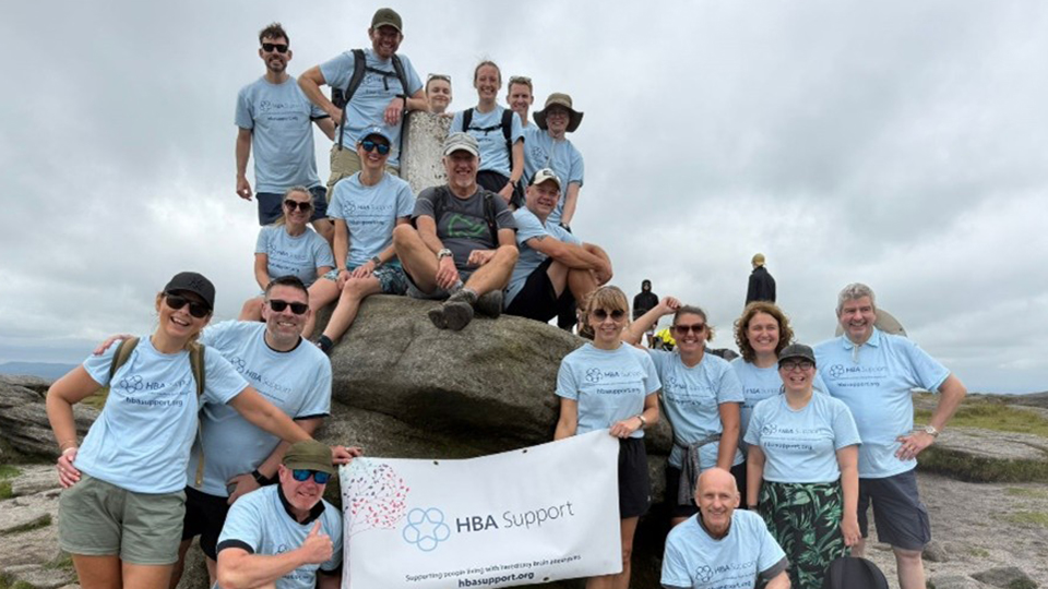 Andy Motch, top left, with Hike for Hope participants at the highest point of the Peak District on Kinder Scout.