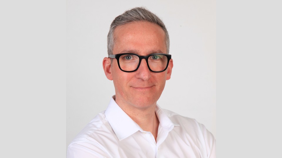 Close-up of Ian Taylor in front of a white background.