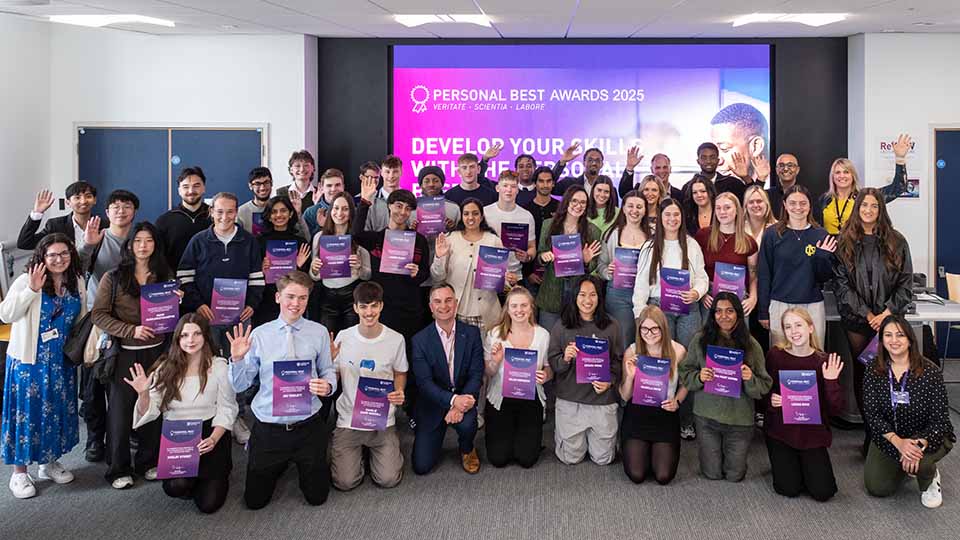 A big group of staff and students posing together at the Personal Best Awards event.