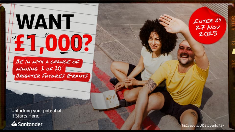 Two people sat on the pavement alongside a notepad page reading 'Want £1,000? Be in with the chance of winning 1 of 10 brighter future grants'.