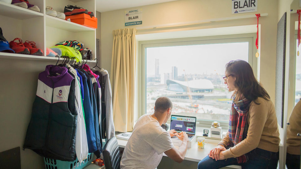 Image of two students in Unite Stratford ONE accommodation.